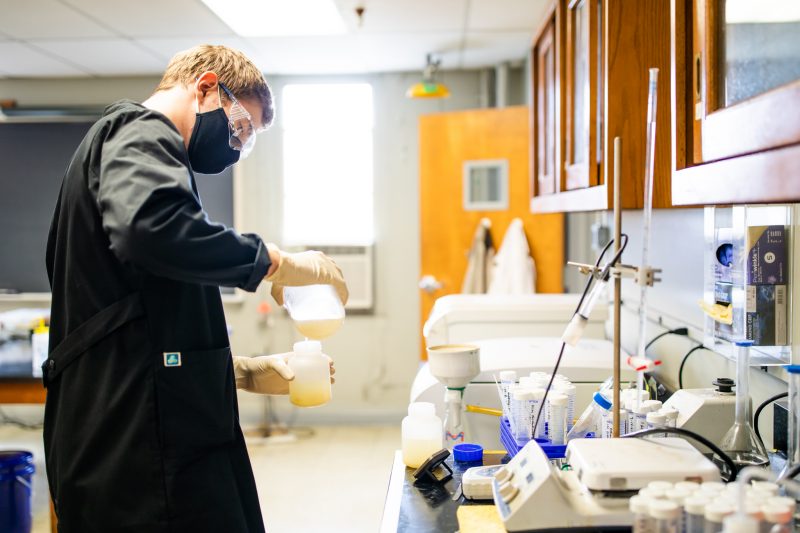 Picture of person pouring chemical 